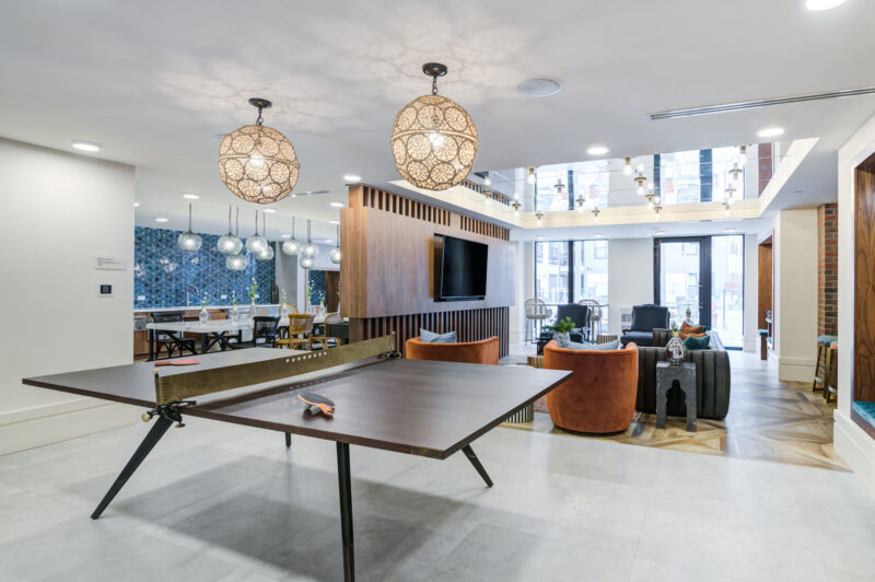 Game room with ping pong and shuffleboard tables