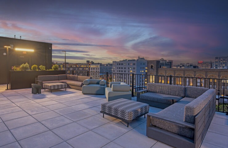 Rooftop lounge with plentiful seating at dusk