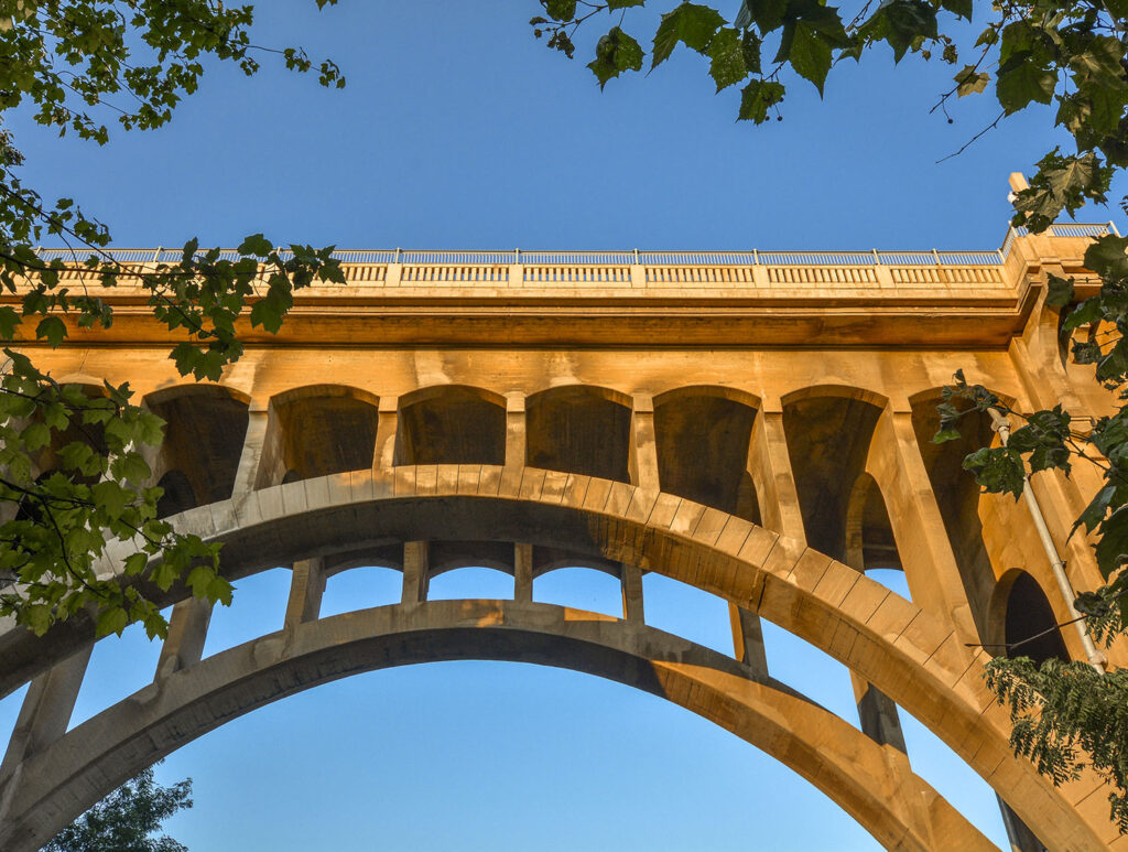 Beautiful tan bridge in Allentown lit up by the sun with blue sky in the background