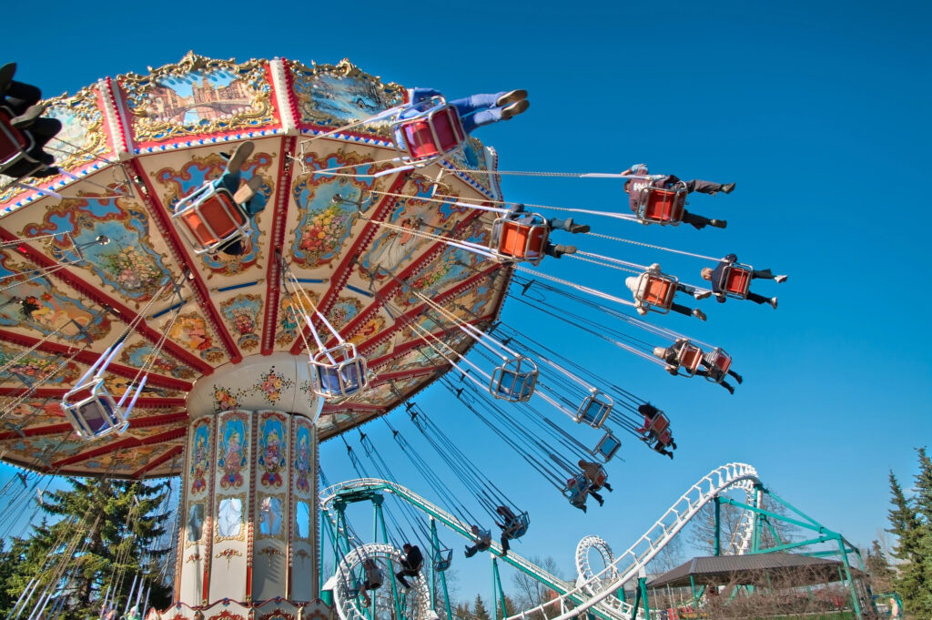 Flying chairs amusement ride with blue sky in the background