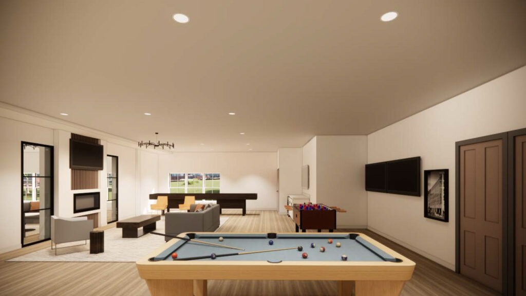 Pool table in a lounge with couches and a television behind it