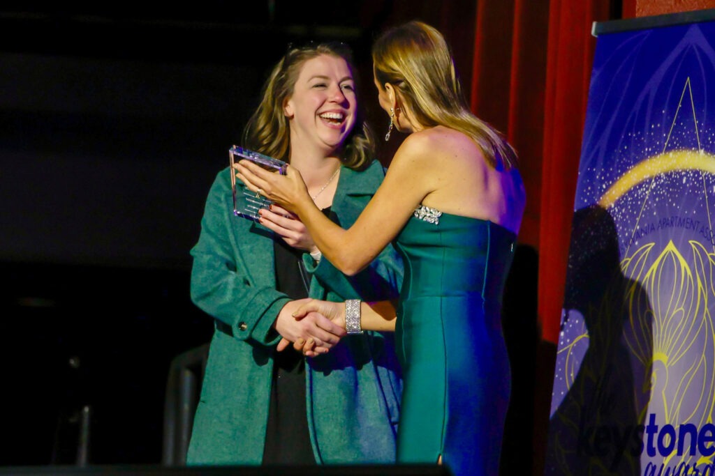 PAA Keystone award winner on stage with award
