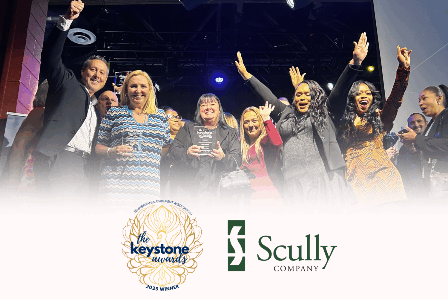 Group photo of Scully Company employees with the Scully logo and Keystone Awards Winner logo