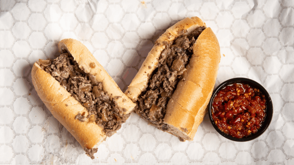 A philly cheese steak with spicy relish in foil