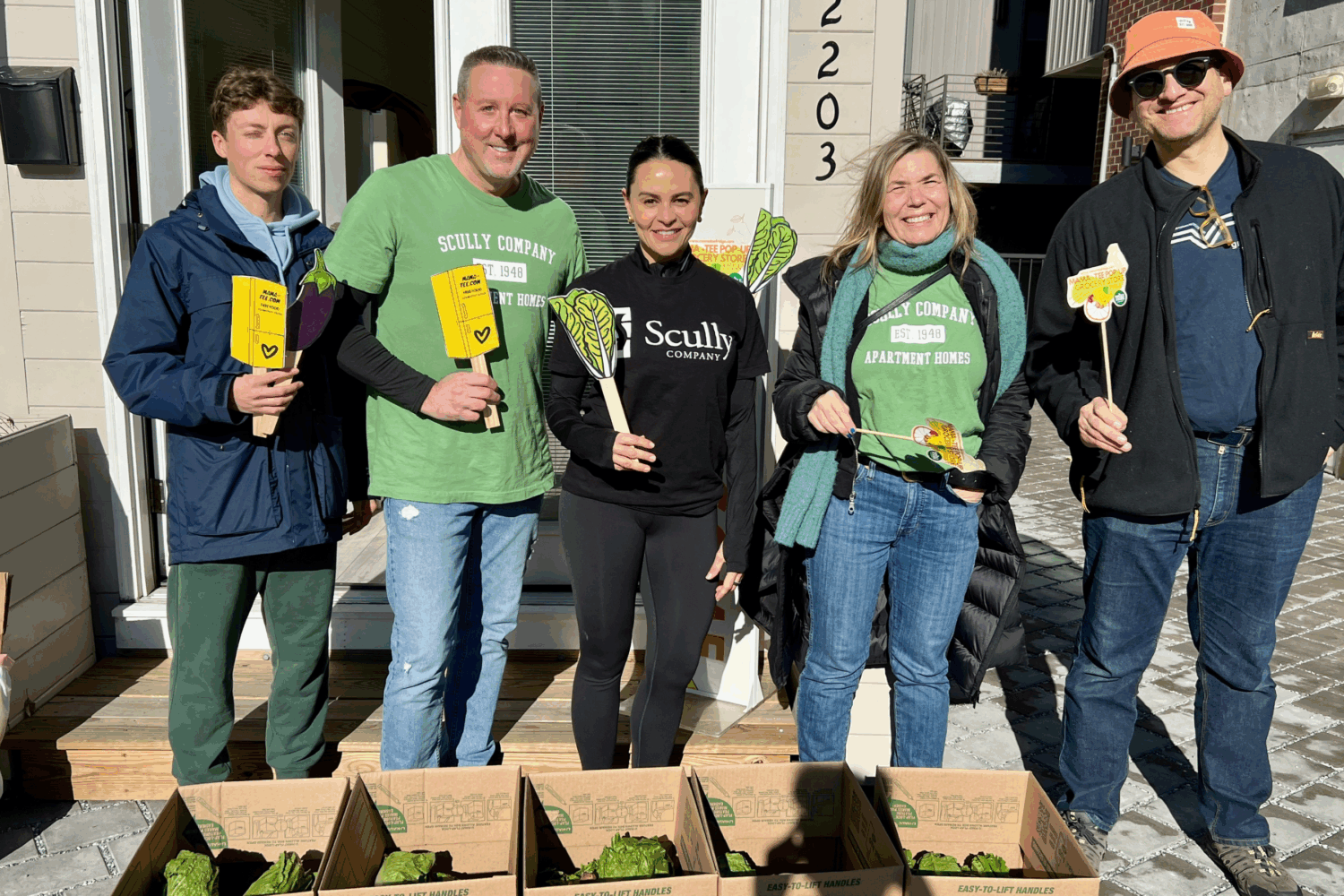 group of Scully Company employees at the Mama Tee pop-up fridge in Philadelphia