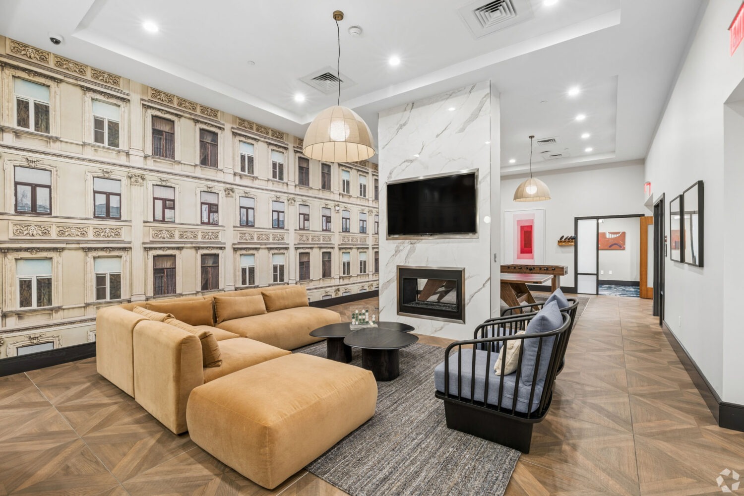 Clubroom with TV, Seating, and Fireplace