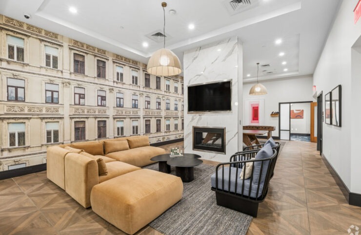 Clubroom with TV, Seating, and Fireplace