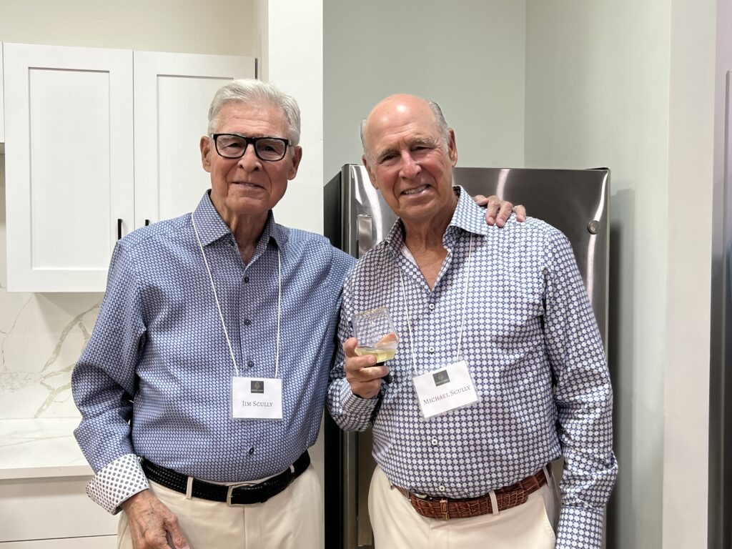 Michael and Jim Scully smiling and posing for a picture