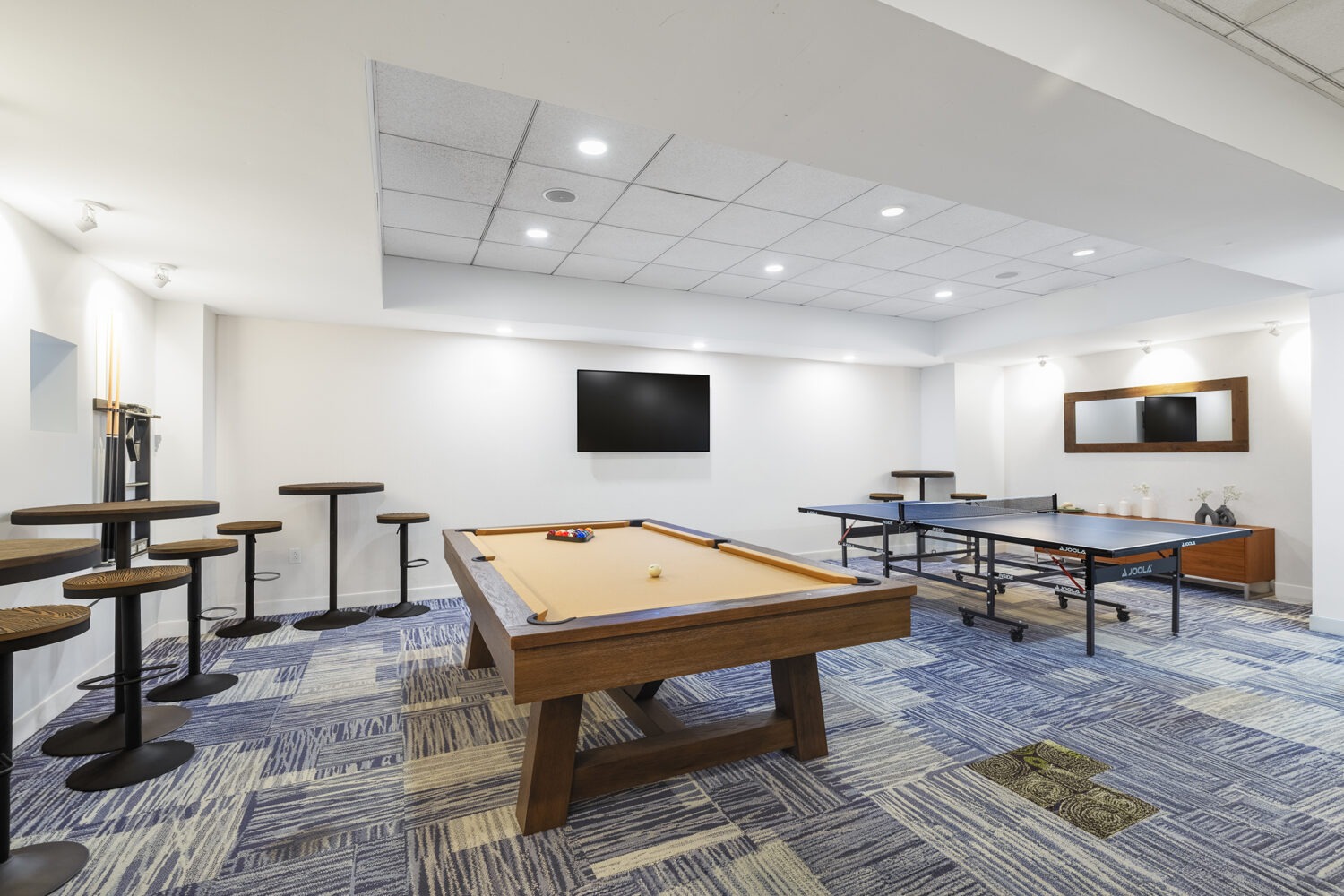 pool table with tv and seating area