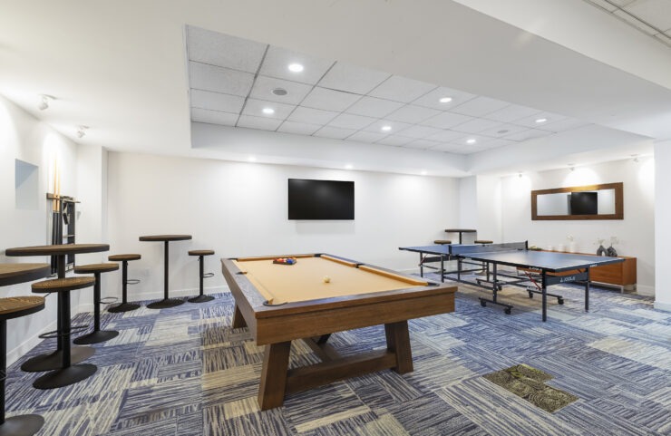 pool table with tv and seating area